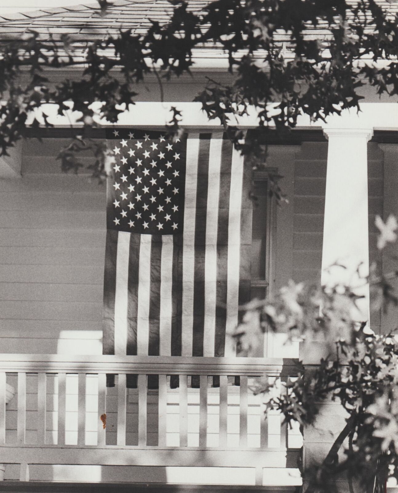 American flag hangs at home, 1980